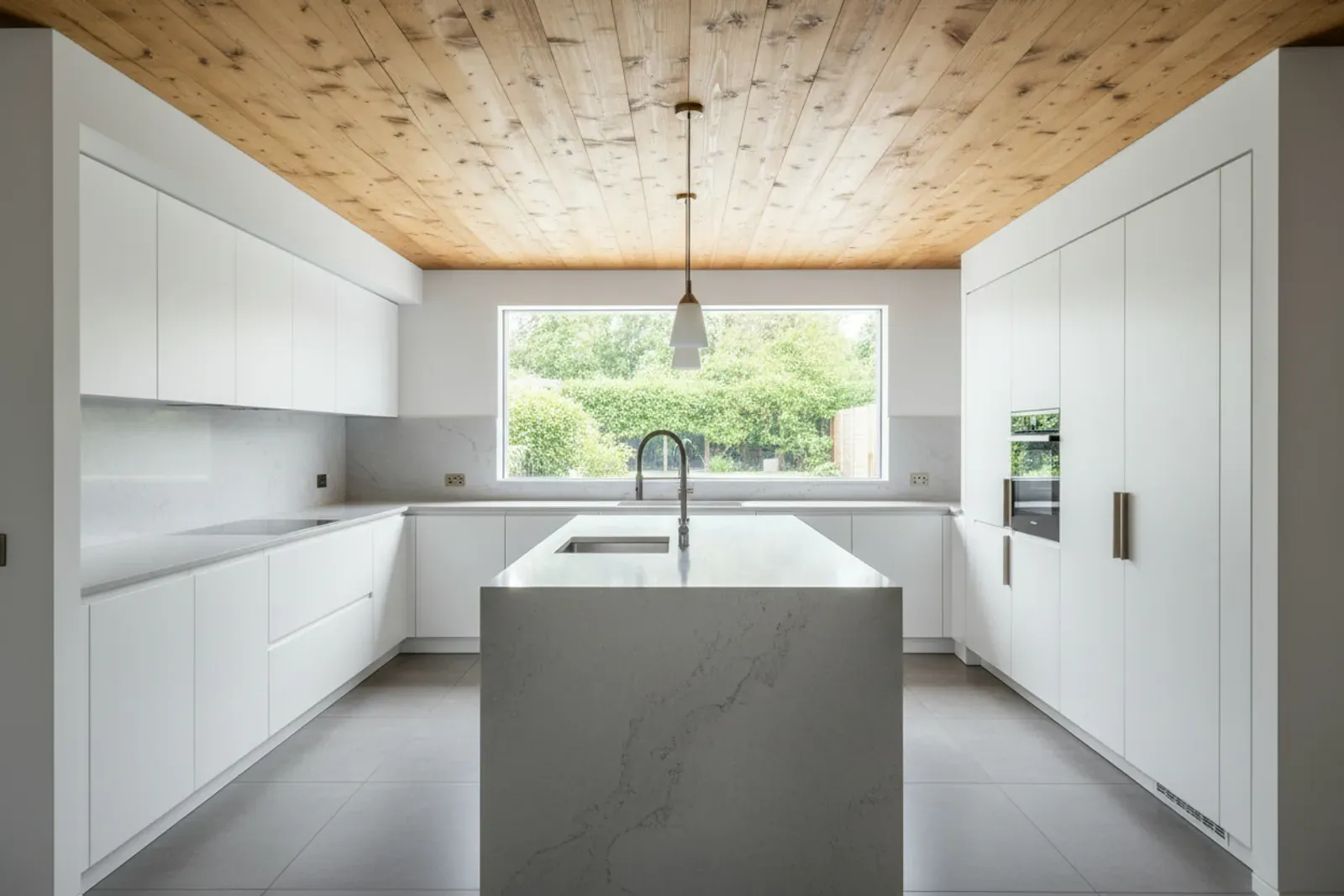 Kitchen ceiling of natural wood boards above white cabinetry