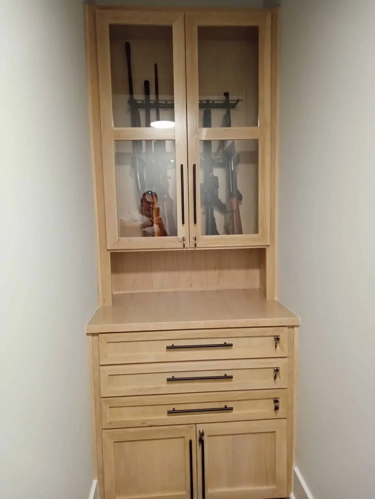 Natural wood hutch cabinet with glass doors and drawers built by Klein Carpentry