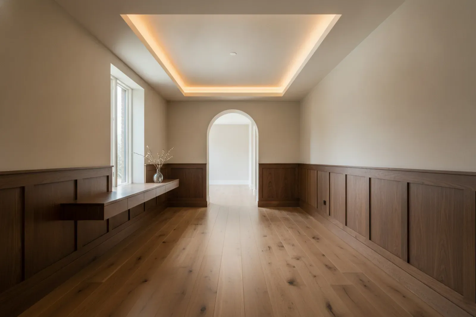 Hallway with a lit cove ceiling detail in painted millwork